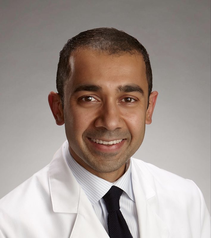 Portrait of Dr. Bilal Naseer in a white coat